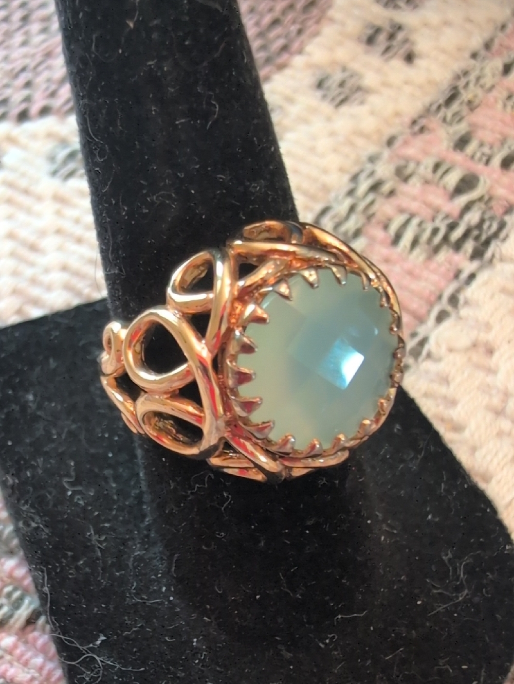 Elegant Gold Colored Filigree Ring with Pale Blue Opalescent Stone